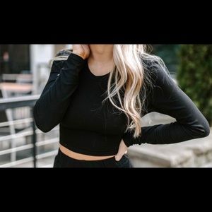 Kittenish open back black top